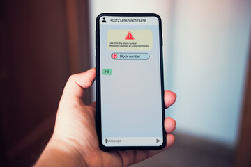 Woman receives message on smartphone from suspected number scam. Unwanted anonymous call. Fraud and phishing phone concept. Message from stranger.