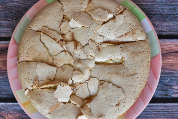 Fresh baked homemade charlotte pie with peaches. Cake with crispy crust served on rustic wooden...