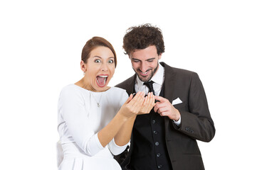 Funny looking couple excited about news they have just read on cell phone 
