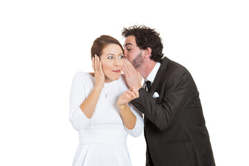 Portrait of a handsome man whispering a secret to a woman 