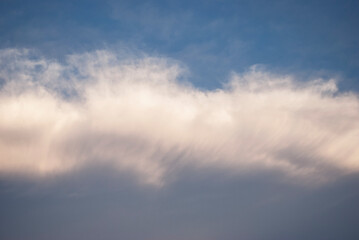 dramatic clouds in blue sky