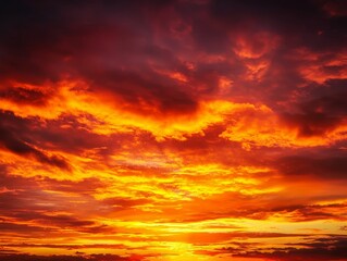 A blazing sunset with the sky aflame in shades of orange, red, and gold.