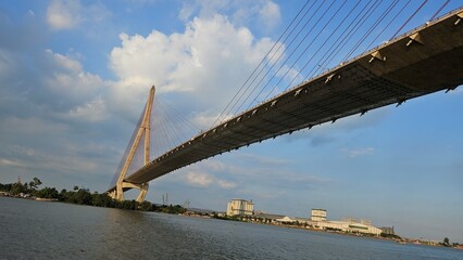 Bottom view of Can Tho cable-stayed bridge beetween Vinh Long city and Can Tho city, Mekong Delta Vietnam in sunset. 
Perspective from Hau river.