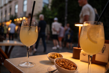Limoncello spritz drink of liqueur, sparkling wine and lemon in cocktail glass