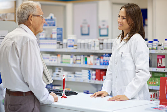 Woman, pharmacist and senior man at counter for consultation, medicine prescription and healthcare advice. Medical worker, elderly customer and discussion of product help, assitance and pharmacy care