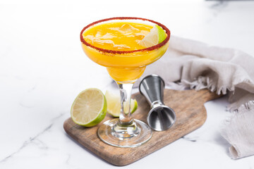 Fresh mango cocktail. Mexican mango cocktail on white marble