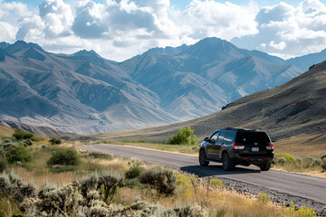 Car driving through mountain pass of Lake District National Park