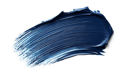 Striking brushstroke of dark blue cosmetic pigment with soft edges on white background