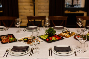 Served dinner table in a restaurant. Restaurant interior