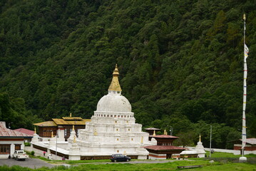 The 17th Century Buddhist Monumental Stupa Chorten Cora in Trashiyangtse, Bhutan, in Green Forest...