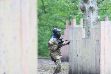 Fototapeta premium kids team play paintball on the field 