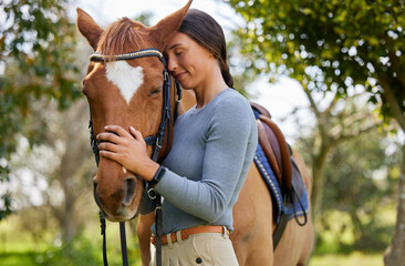 Rider, woman and bonding with horse outdoor in forest for companion, training and relax from...