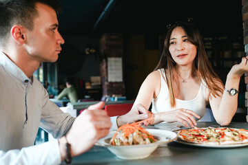 Coworker couple having lunch together