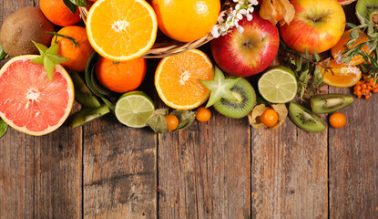 fresh fruits on wood background
