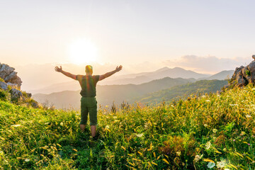 man doing hiking sport in mountains with anazing highland view