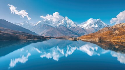 Fototapeta premium A serene aerial view of a South Asian mountain lake, with snow capped peaks reflected in the still waters.