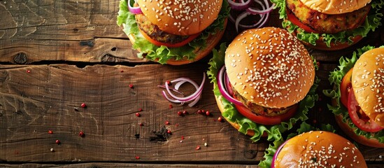 Closeup of homemade vegetarian aloo tikki burgers on a wooden surface. Copy space image. Place for adding text and design