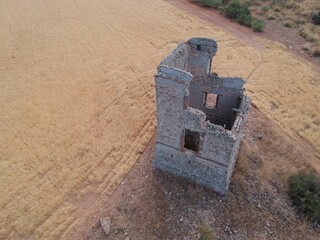 19th-century stone telegraph tower viewed from the air by a drone