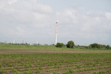 Kharedi, Gujarat, Indian-08-08-2024: Sustainable Energy Harvest: Wind Turbines Over Farmland