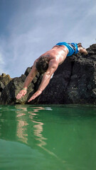 person jumping in water