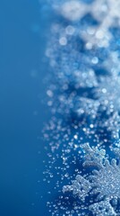 Golden snowflakes and stars on a snowy background with a warm glow. Ideal for Christmas cards and winter holiday designs.