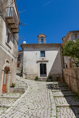 A street between old houses in Carovilli, a village in Molise in Italy.