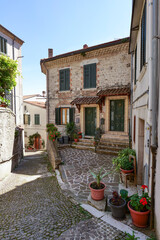 A street between old houses in Carovilli, a village in Molise in Italy.