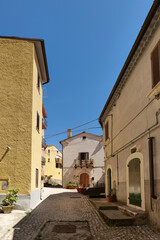A street between old houses in Carovilli, a village in Molise in Italy.