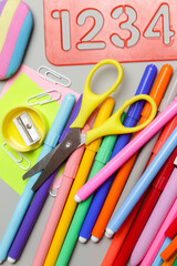 Fototapeta premium Back to school concept with variety of office and school supplies on grey background. 