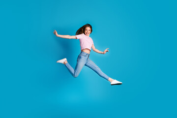 Fototapeta premium Full body photo of attractive young woman running hurry black friday dressed stylish striped pink clothes isolated on blue color background