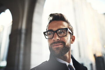 Fototapeta premium Thinking, business and man in city, pride and commute with fashion, solution and consultant. Person, decision and employee in street, glasses for clear vision and professional with corporate clothes