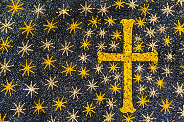 Mosaic representing a yellow cross around lots of stars