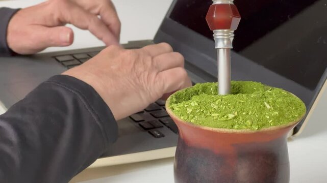 Gaucho woman working in the office, drinking mate. Farroupilha Week of the Gauchos.