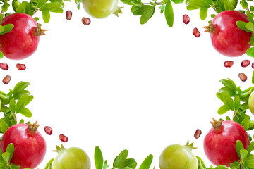 Frame of fresh pomegranate fruits, green leaves and seeds isolated on white background.