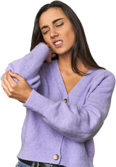 Fototapeta premium Hispanic young woman massaging elbow, suffering after a bad movement.