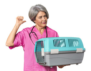 Caucasian mid-age vet holding pet carrier feels proud and self confident, example to follow.