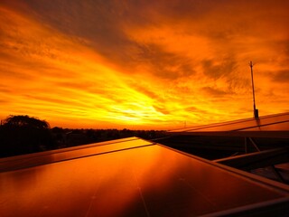 sunset in the city,solar panels generate energy