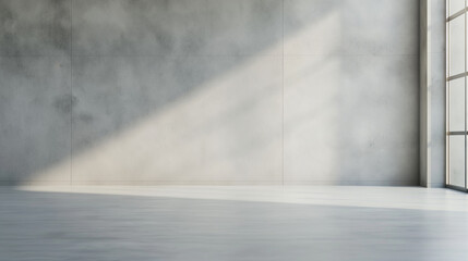 A large, empty room with a window and a wall