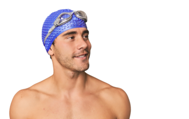 Close-up of Hispanic male swimmer with goggles, winner's attitude