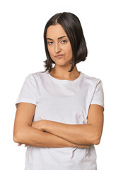 Fototapeta premium Young Caucasian woman with short hair suspicious, uncertain, examining you.