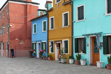  Burano Island is a picturesque destination featuring charming, multicolored houses owned by local residents in the Venetian lagoon.