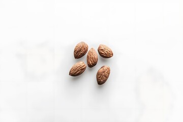Five Almonds on a White Surface