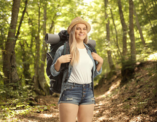 Young female backpacker in a forest