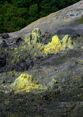 Close-up of a yellow sulfuric rock in the Tamagawa Onsen