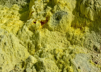Close-up of a yellow sulfuric rock in the Tamagawa Onsen