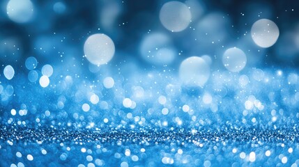 Fototapeta premium Blurry blue glitter background with twinkling bokeh, offering a spacious area in the middle for text. Perfect for winter or magical themes.