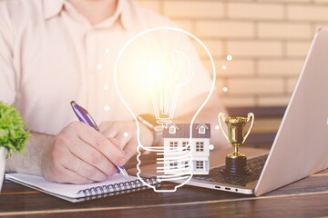 A businessman thinks and writes down his ideas. Success and innovation concept. Creative thinking is the key to success