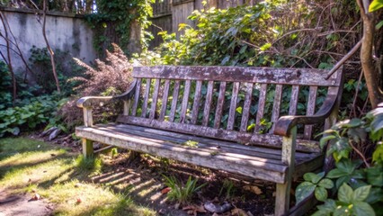 Weathered Wooden Bench in a Lush Garden Setting