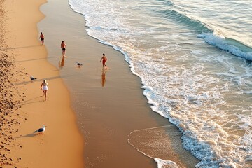 A peaceful dawn beach scene viewed from above, with soft waves, golden sand, and seagulls flying across the sky.
