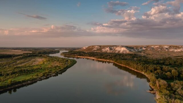 Aerial hyperlapse of chalk hills and river at sunrise (sunset). Beauty of nature.
